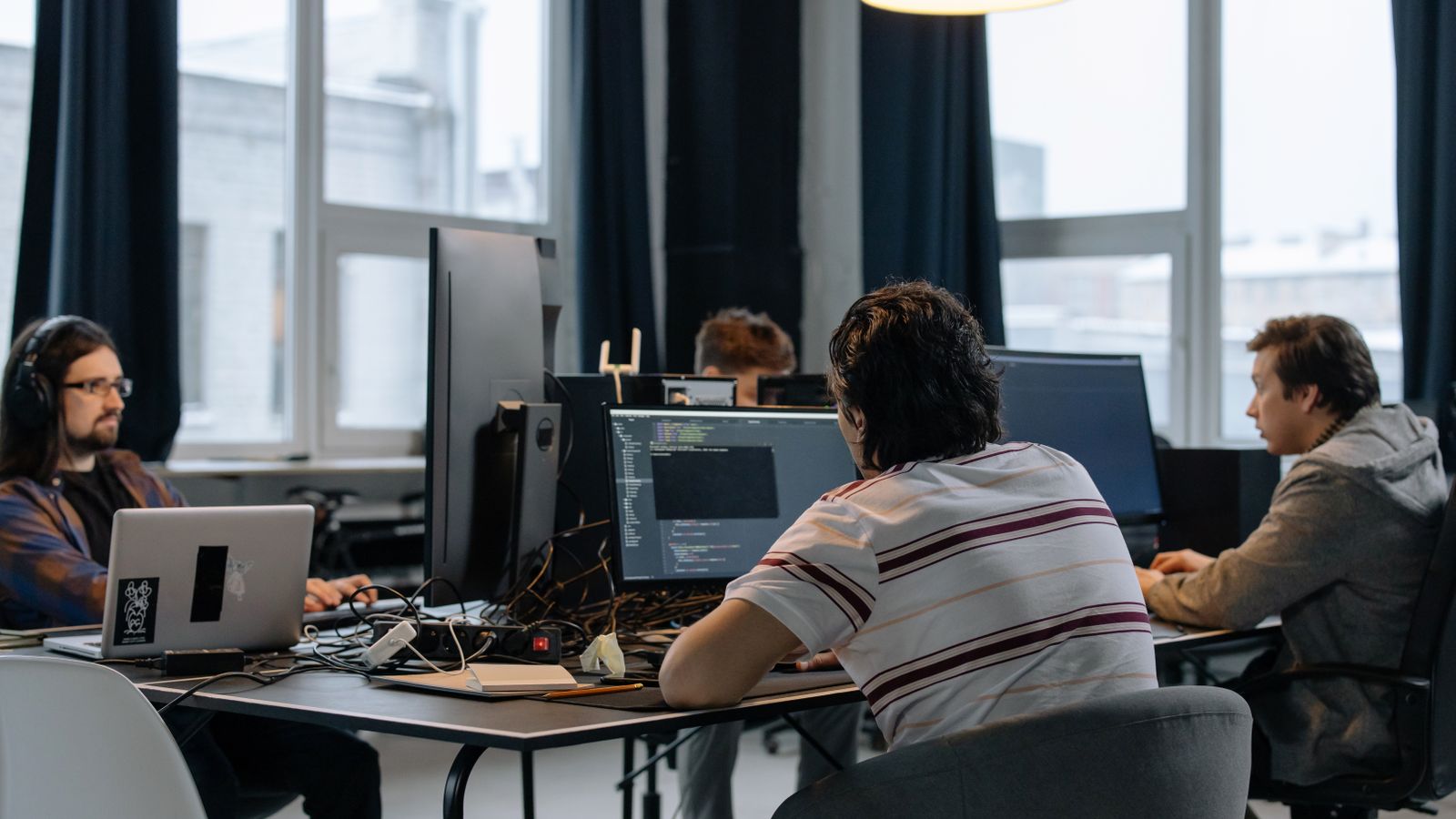 The Galactica CyberSecurity team collaborating in the office